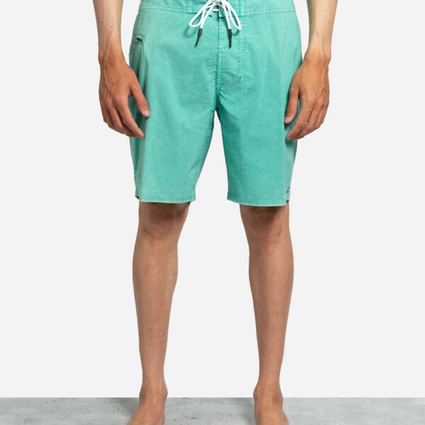 Man wearing green swim shorts