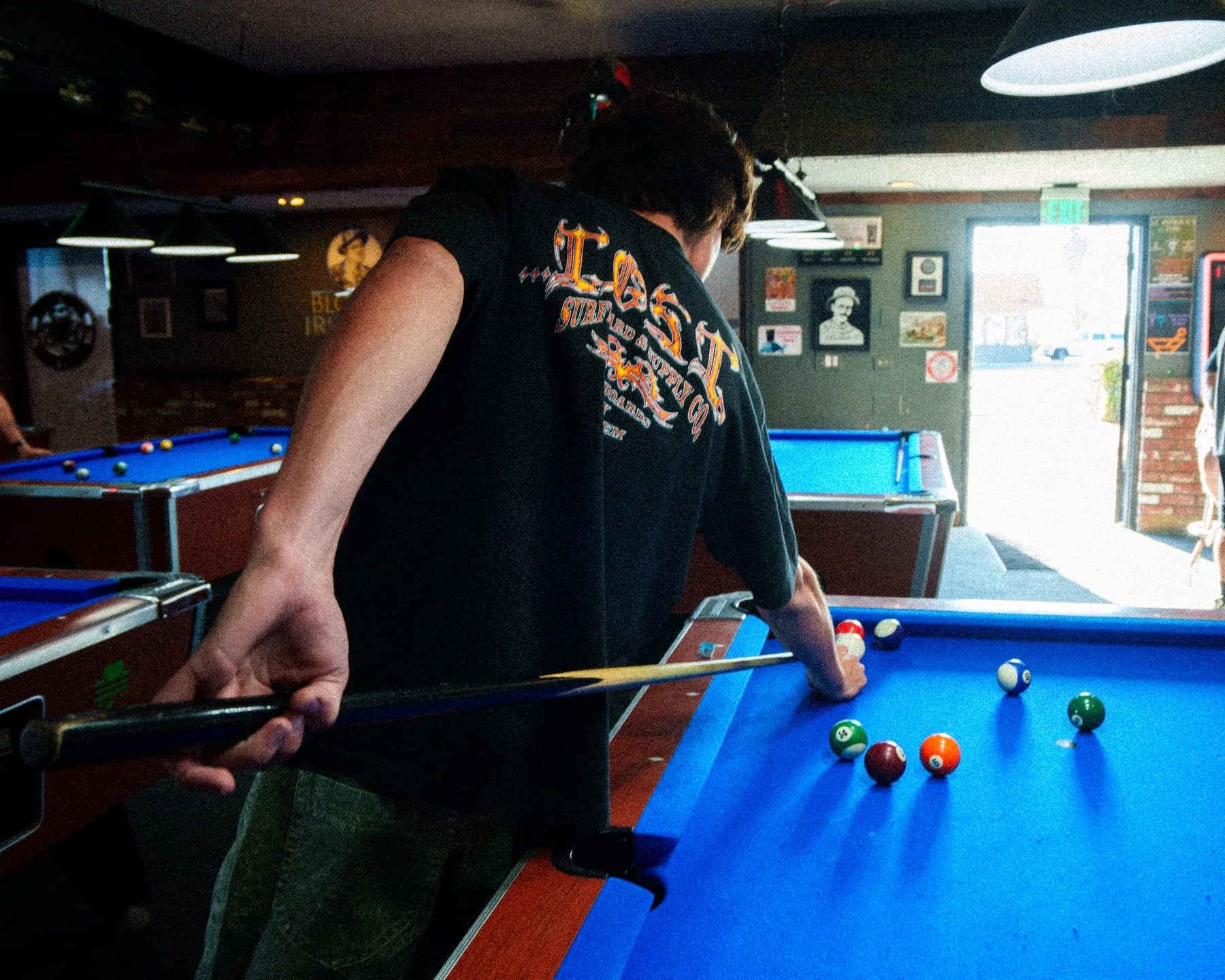 Man lining up a pool shot.