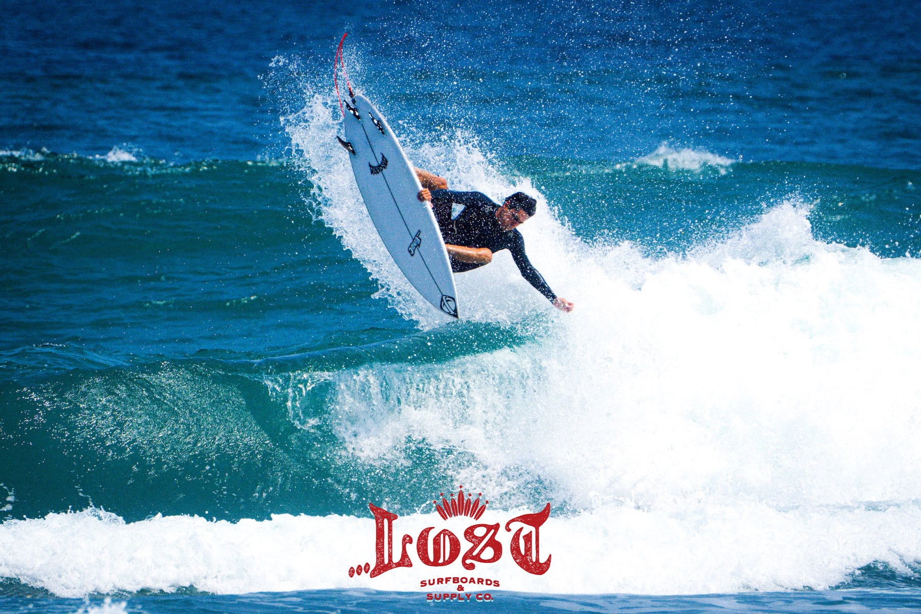 Athlete surfing high above crashing waves