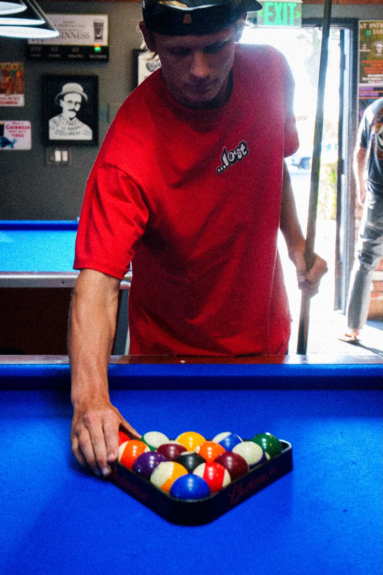 Person arranging billiard balls for game
