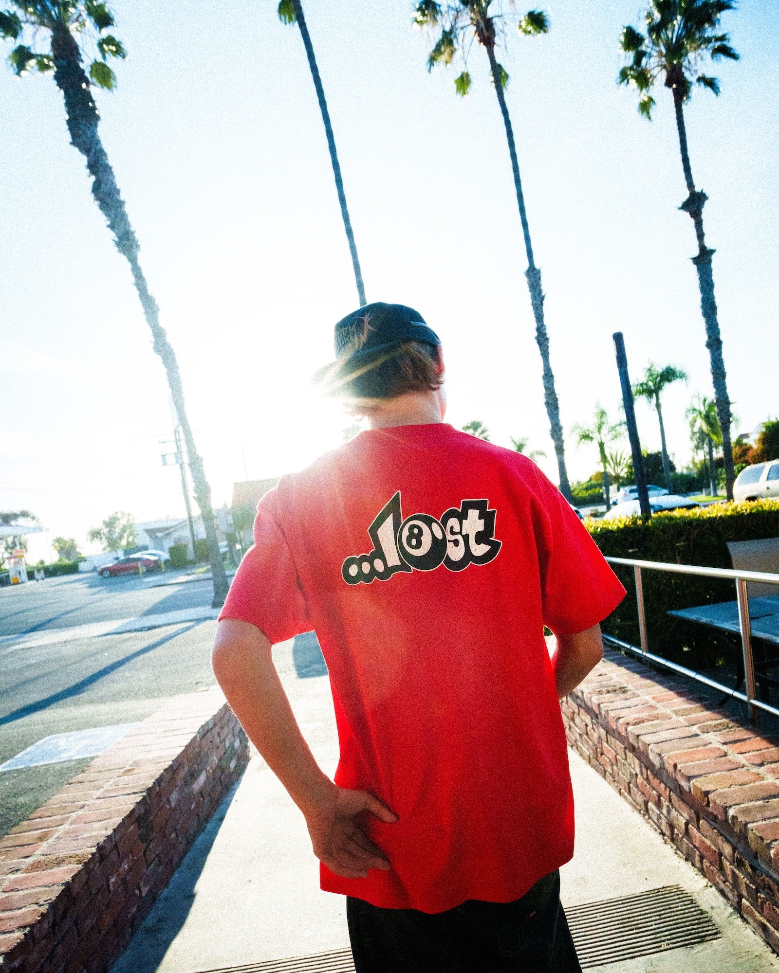 Back of person wearing red shirt
