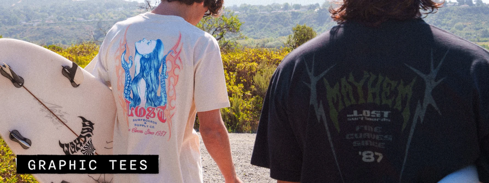 Two men with surfboards and tees