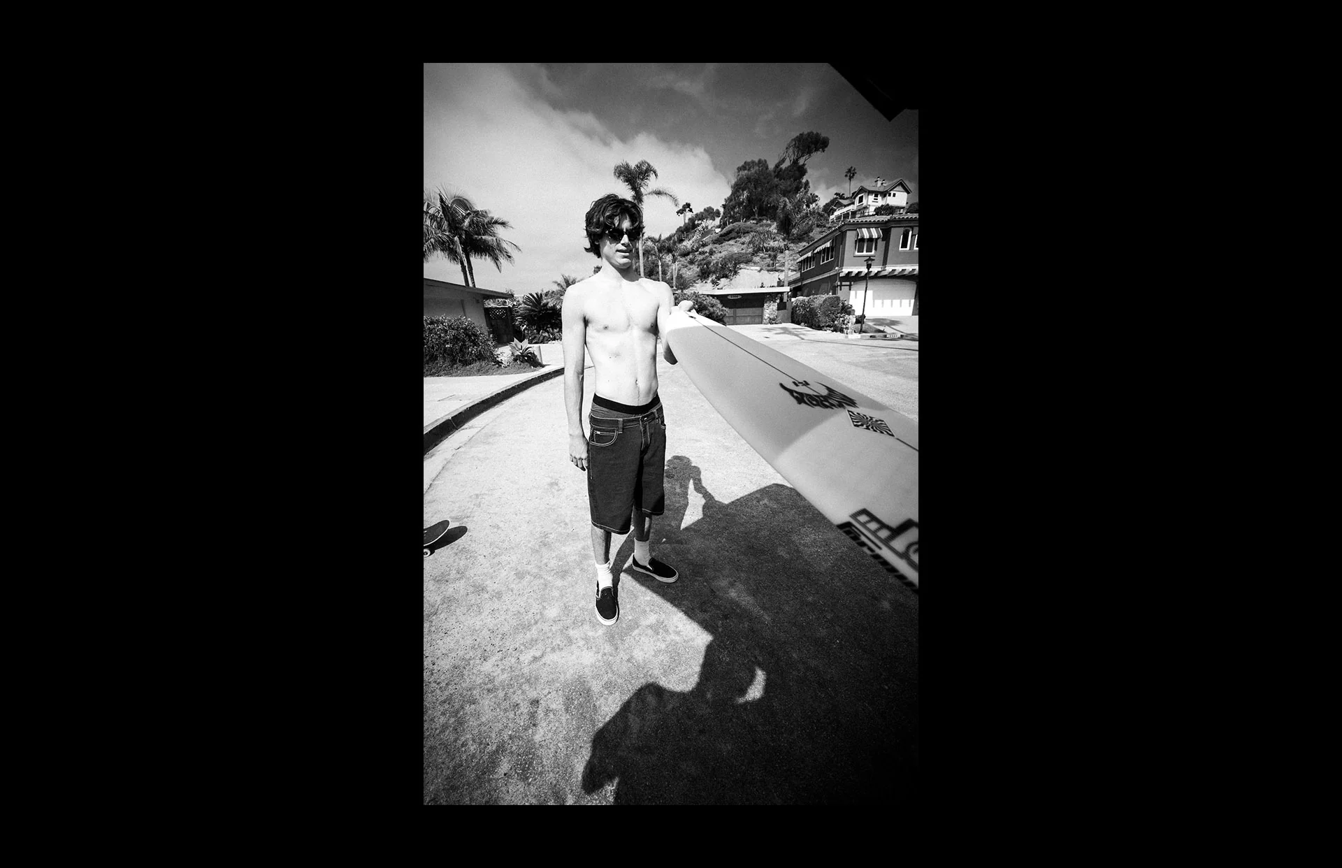 Black and white street scene with skateboarder