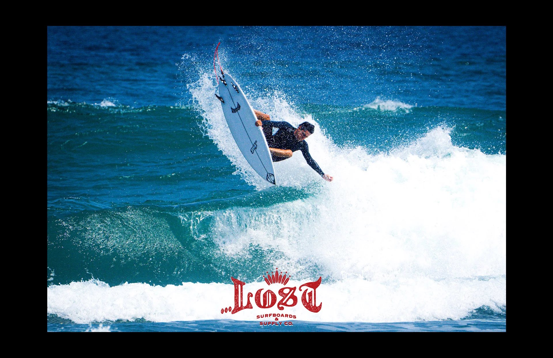 Surfboard mid-air above ocean wave