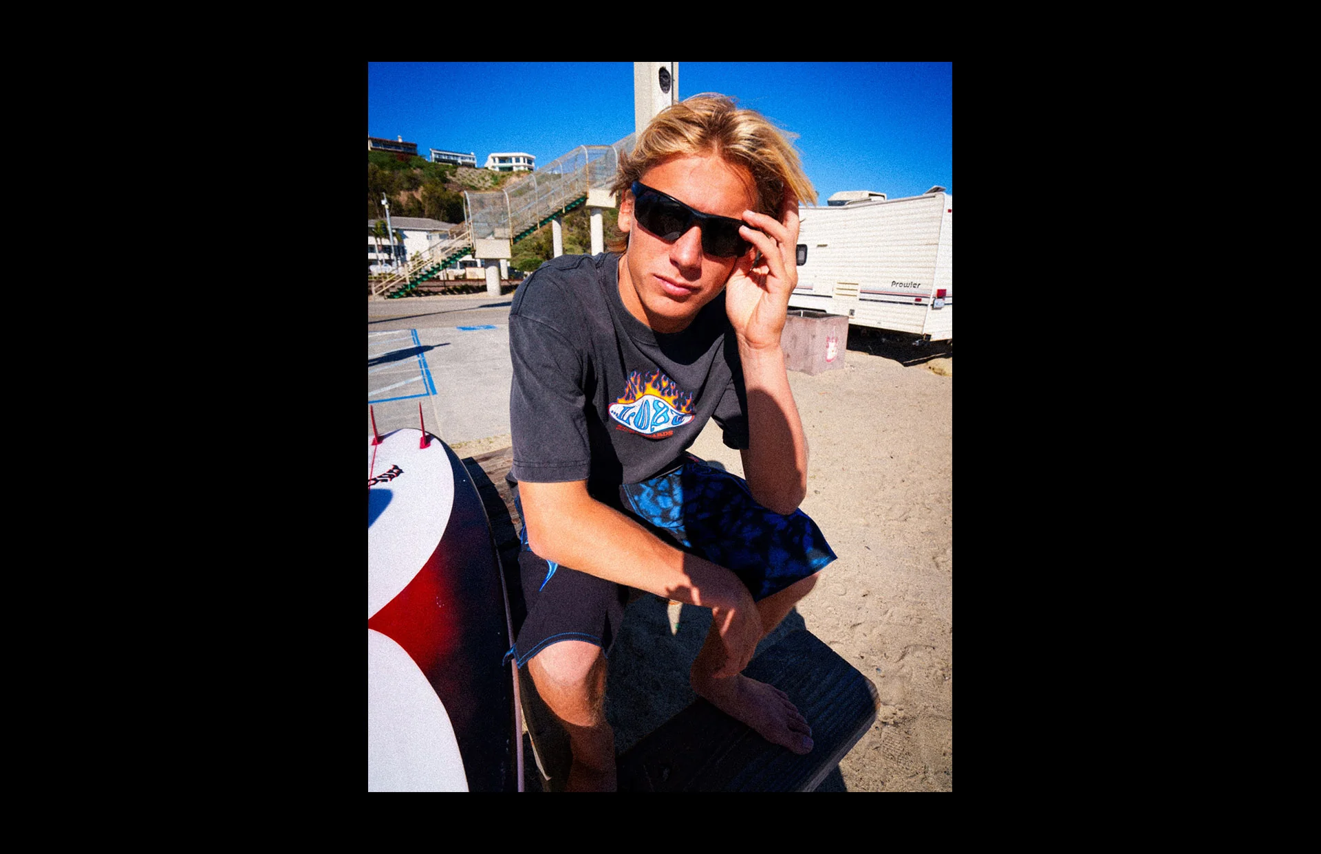 Surfer wearing sunglasses on the beach